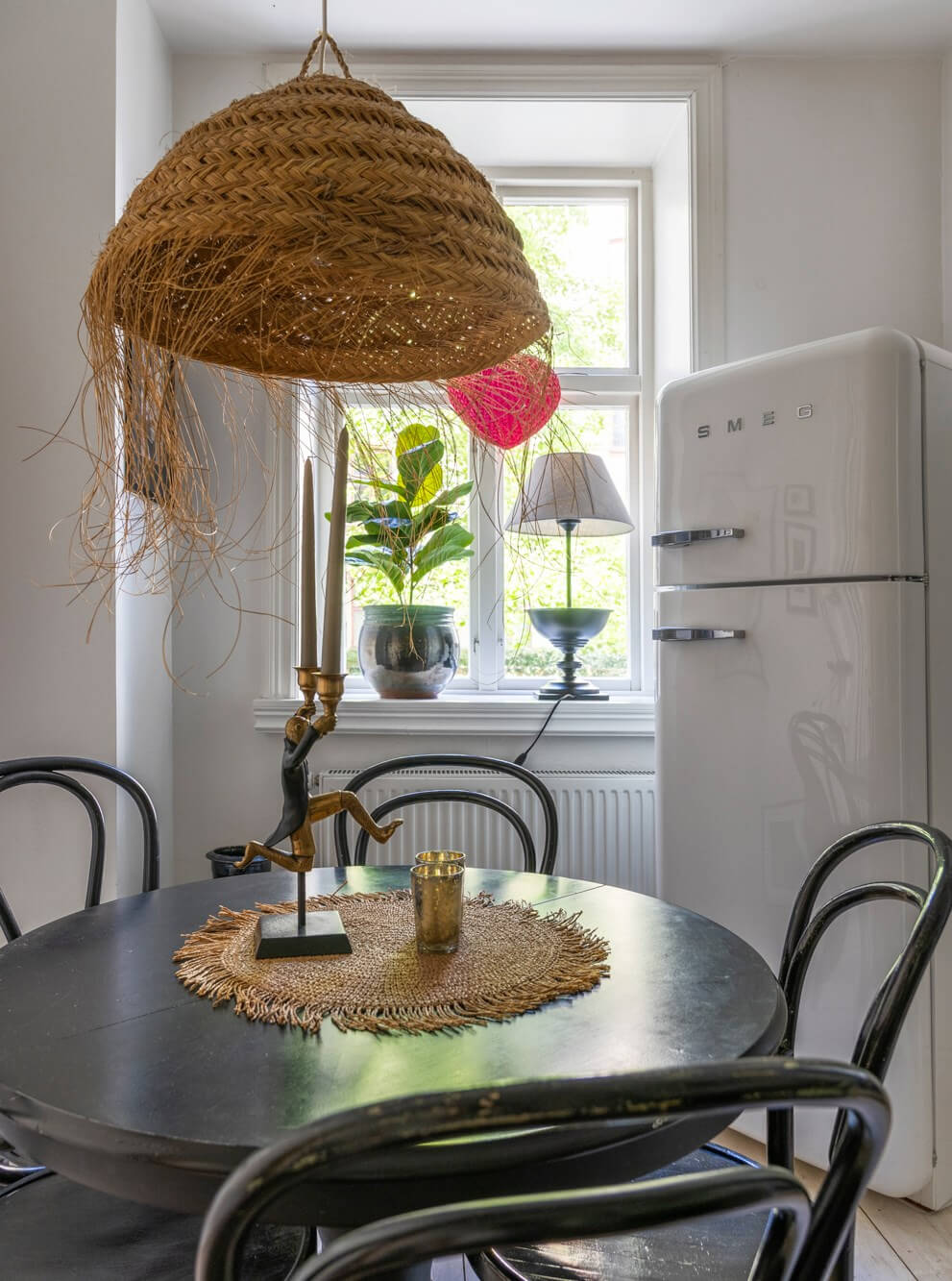 black round wooden kitchen table smeg fridge
