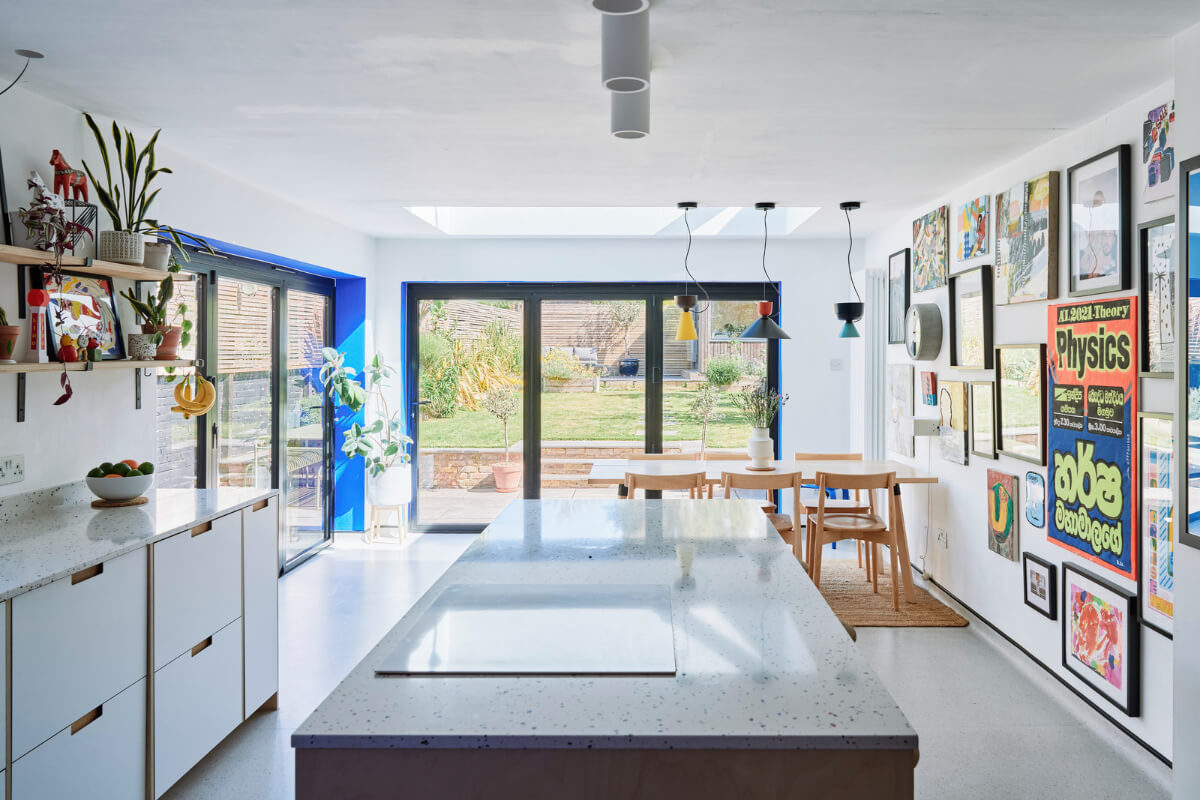 Colorful Rooms and a Modern Kitchen in a Spacious Family Home 7 bright kitchen dining space cobalt blue accents Colorful Rooms and a Modern Kitchen in a Spacious Family Home
