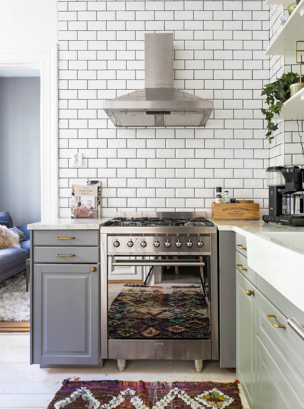 gray kitchen brass fittings white metro tiles