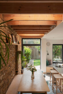 Exposed Brick and Wooden Beams in an Extended London Home - The Nordroom - Exposed Brick With Wooden Accents