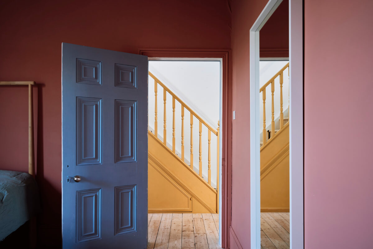 Colorful Rooms and a Modern Kitchen in a Spacious Family Home 16 pink bedroom blue door