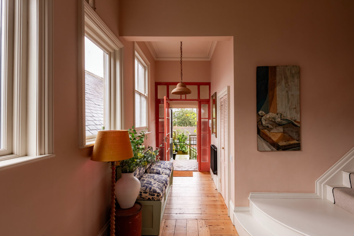 pink hall wooden floorboards