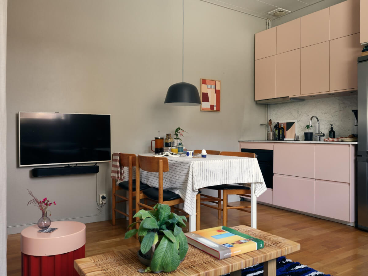 small apartment living space light pink kitchen