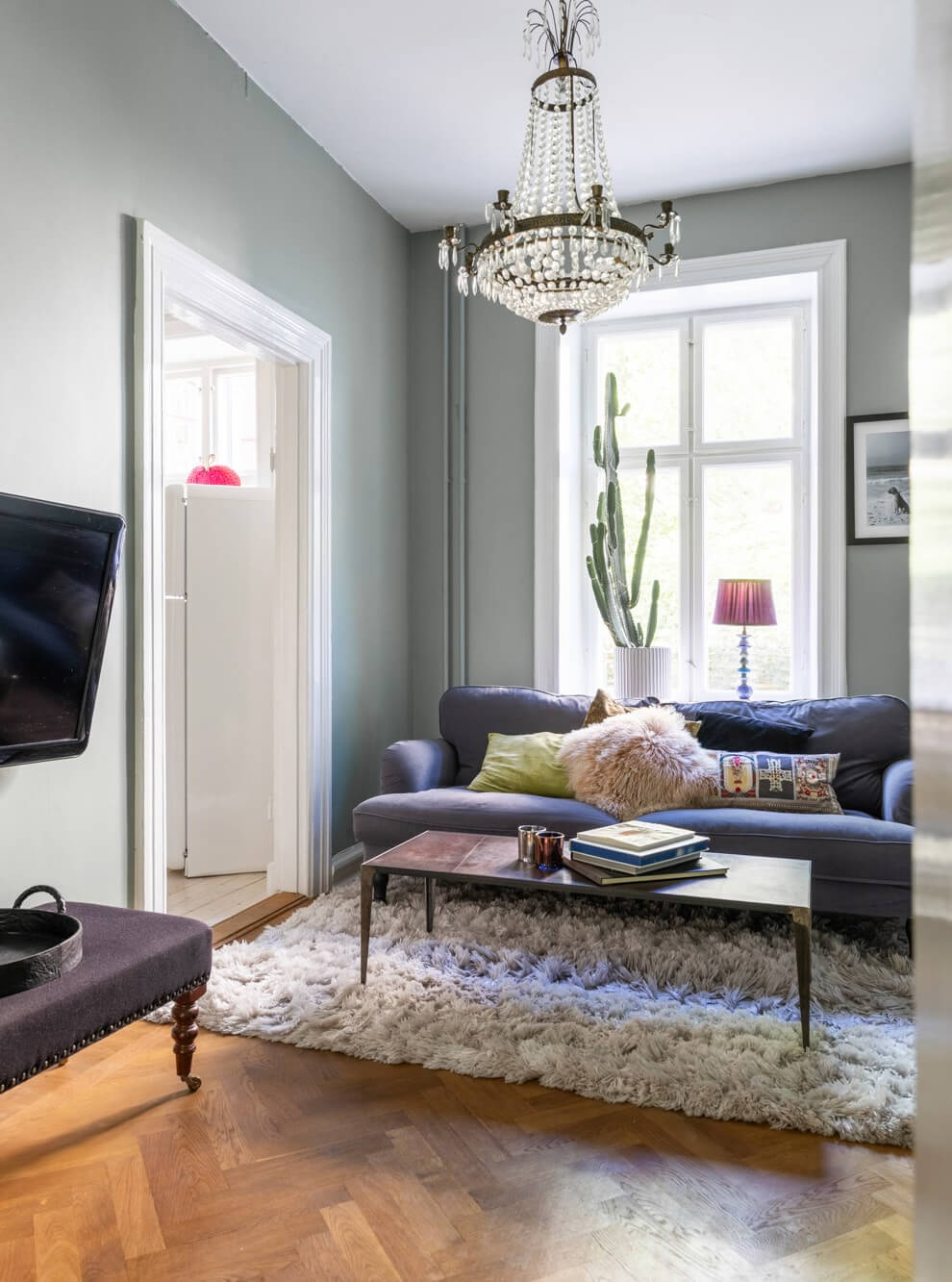 small sitting room blue sofa parquet floor