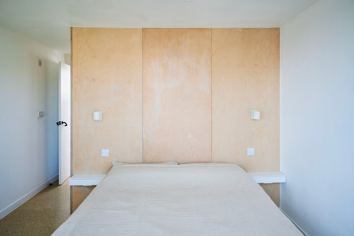 Colorful Rooms and a Modern Kitchen in a Spacious Family Home 23 white bedroom plywood headboard
