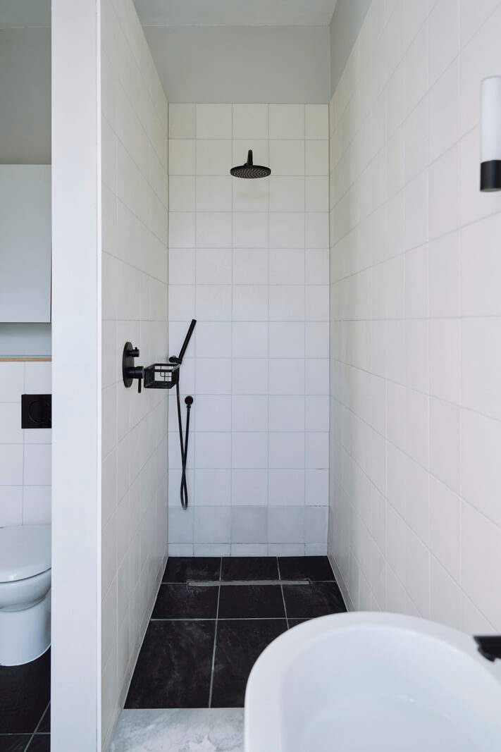 Colorful Rooms and a Modern Kitchen in a Spacious Family Home 20 white-tiled bathroom