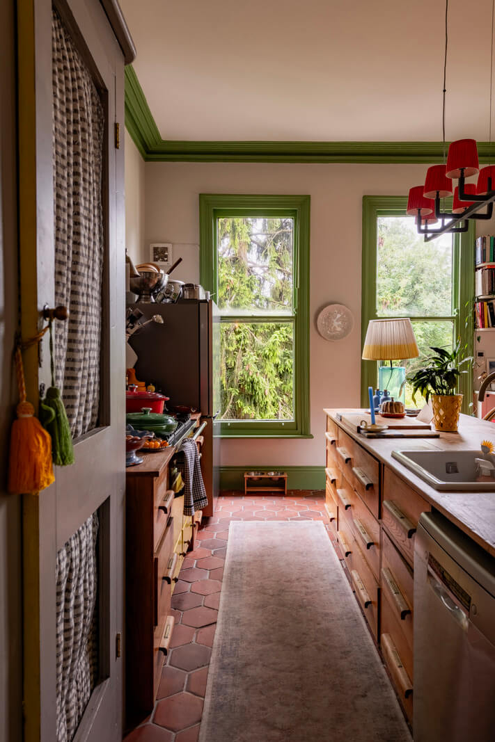 wooden kitchen terracotta floor tiles green window frames