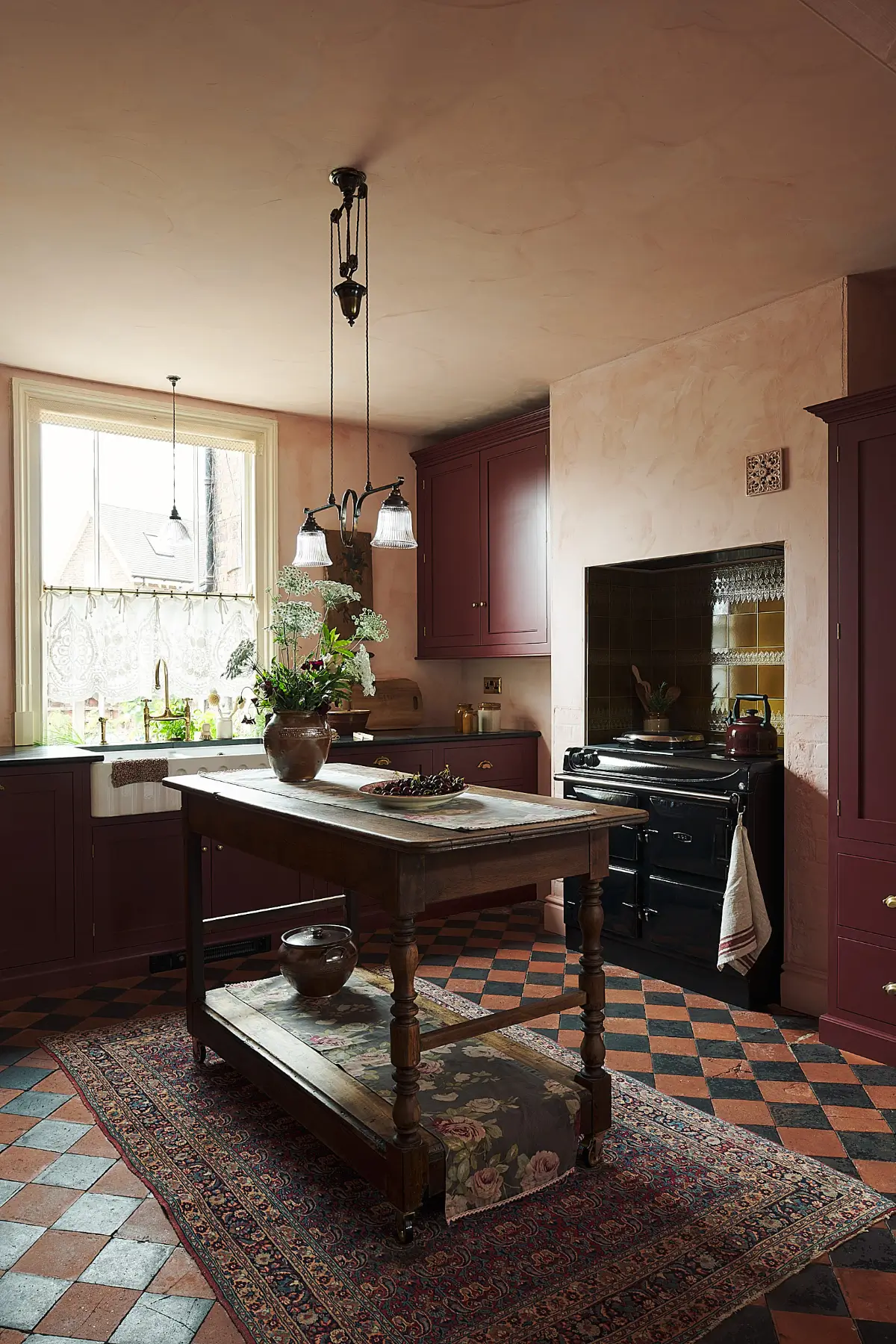 A Deep Red deVOL Kitchen with Vintage Elements in a Victorian Home