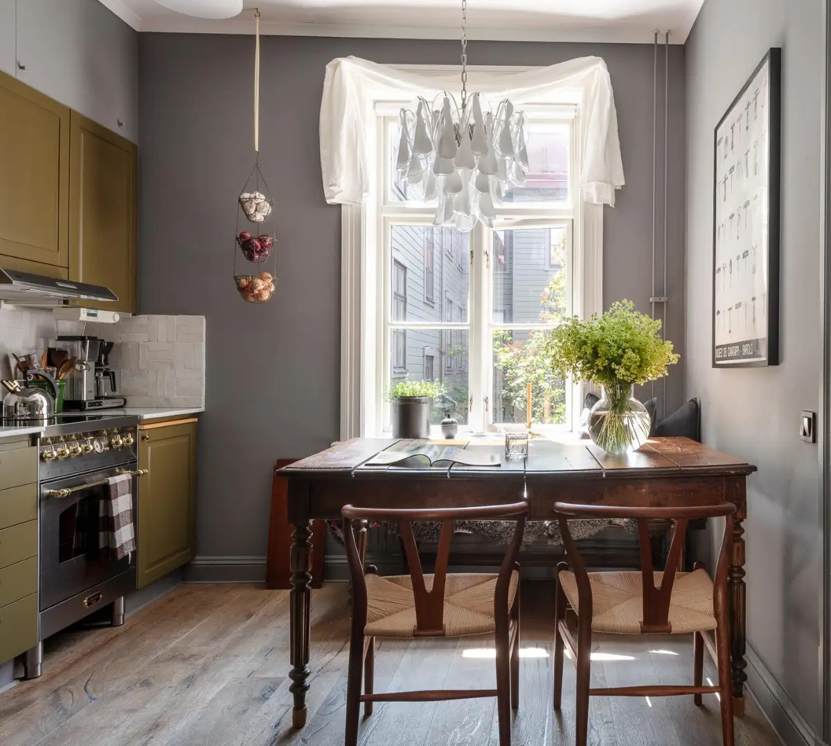 A Dark Gray Swedish Apartment with an Olive Green Kitchen 2 antique kitchen table