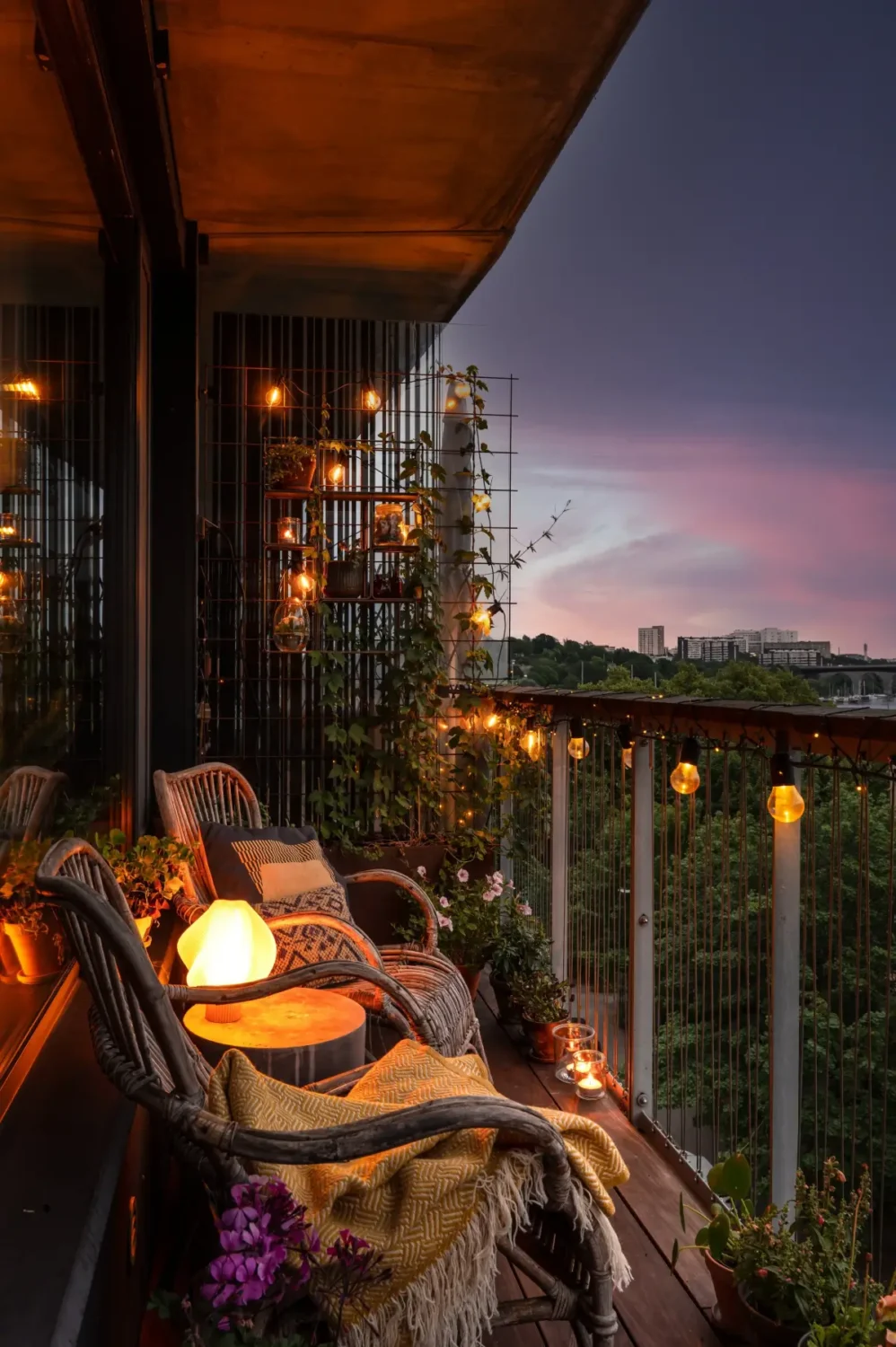 A Modern Swedish Apartment with Half-Painted Pink Walls 7 balcony at night