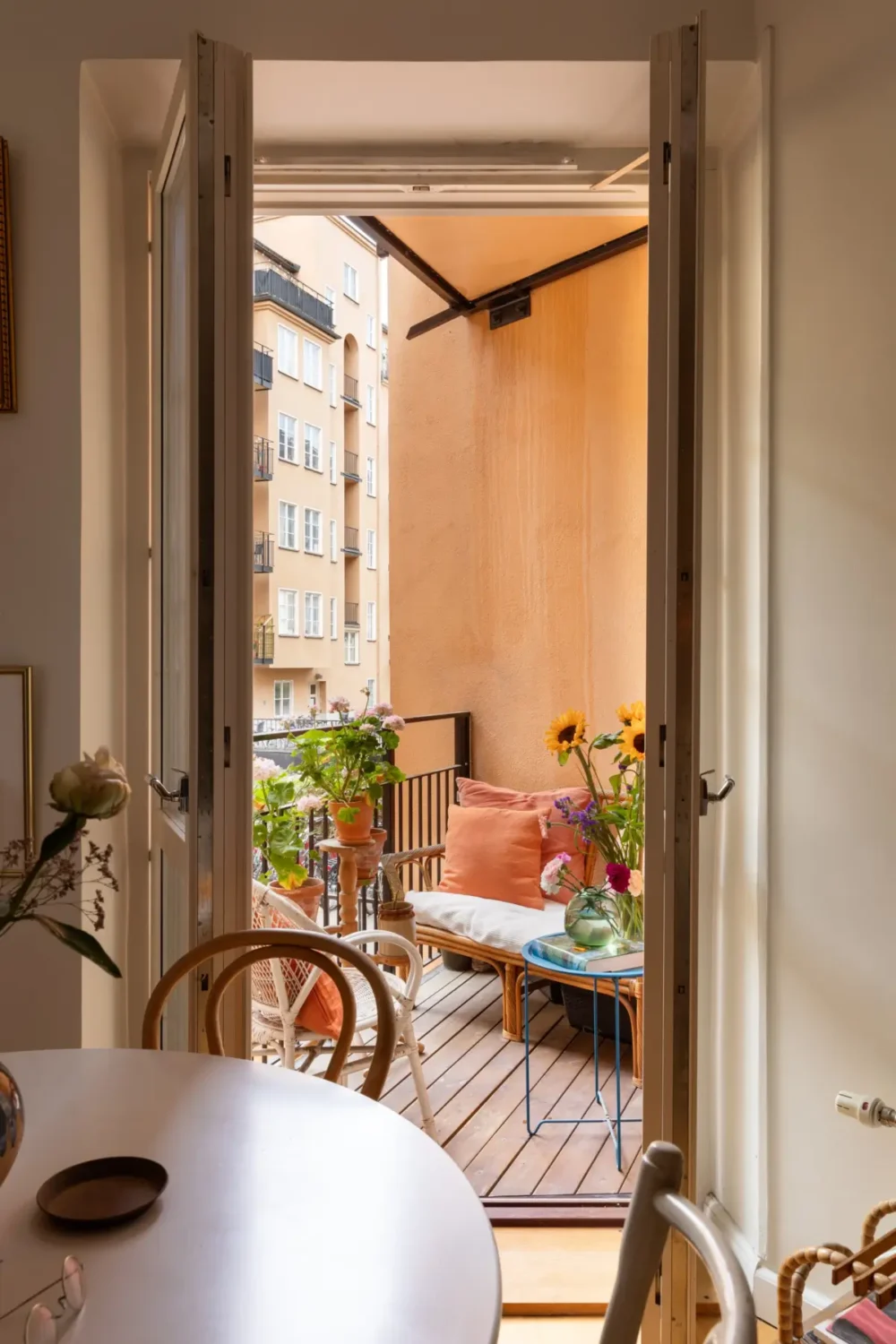 A Cozy 1920s Apartment Filled with Books, Art, and Music 12 balcony door
