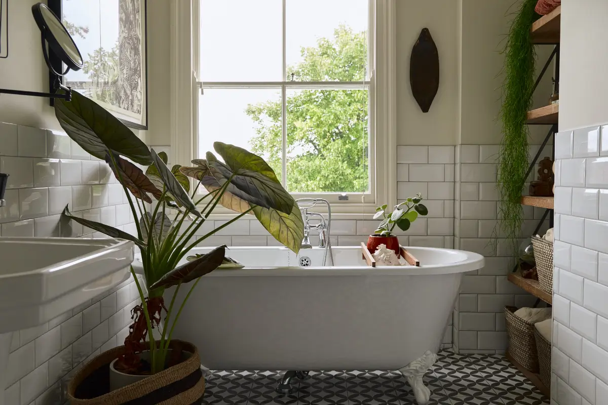 A Classic Victorian Duplex with a Lush, Private Garden in London 26 bathroom freestanding bath wooden built-in shelves