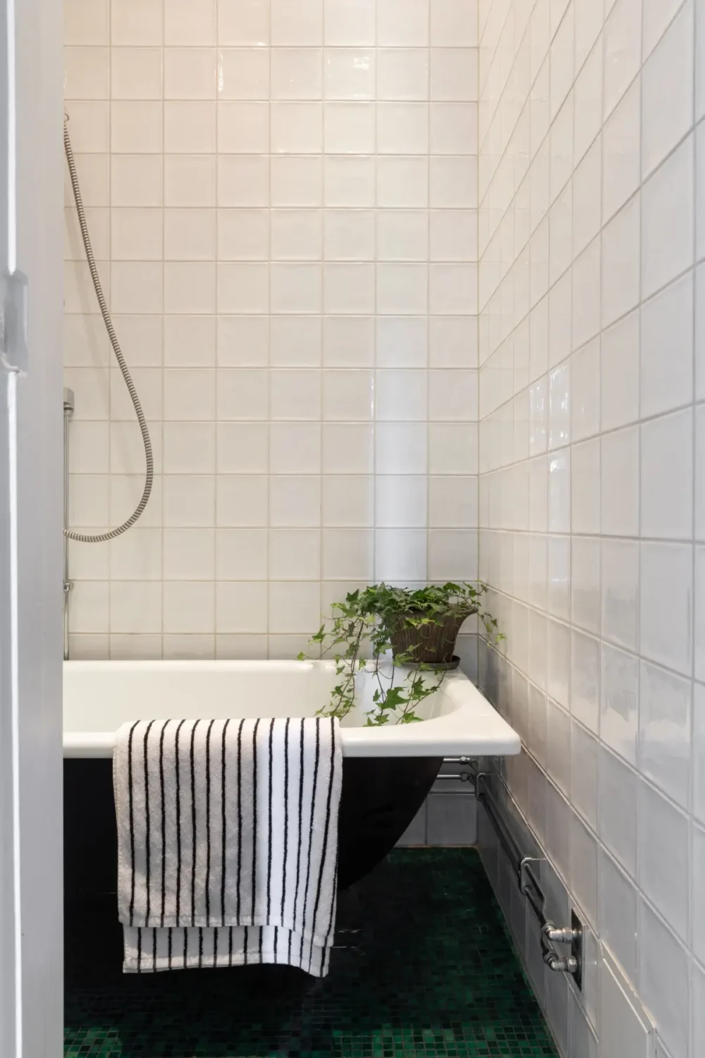 A Cozy Colorful Family Apartment with an Industrial Room Divider 19 bathroom green floor tiles