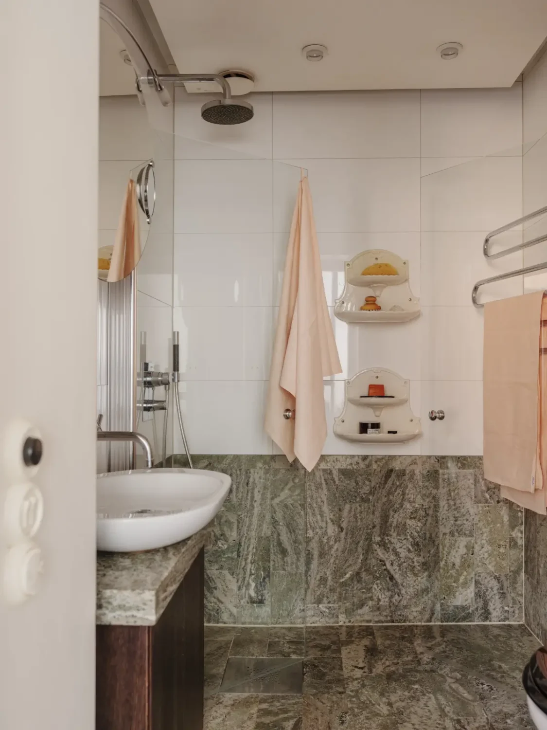 A Classic Late 19th Century Apartment with Magnificent Views of Stockholm 29 bathroom green marble tiles A Classic Late 19th Century Apartment with Magnificent Views of Stockholm