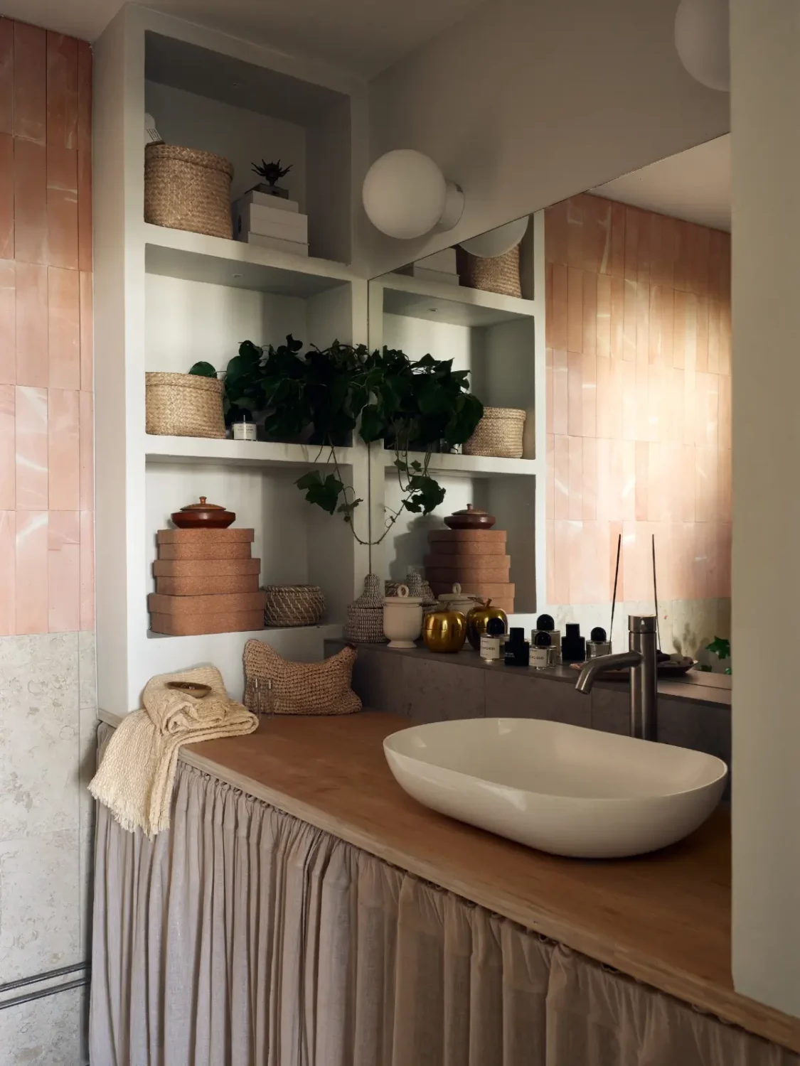 Industrial Elements in a 1960s Duplex Apartment in Stockholm 40 bathroom pink tiles open storage