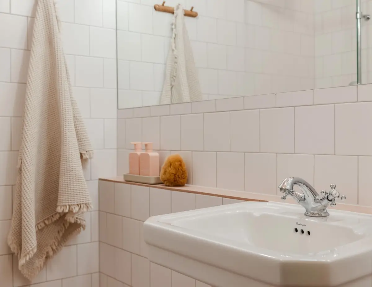 Colorful Rooms in a Practical Stockholm Family Apartment 19 bathroom sink pink shelf