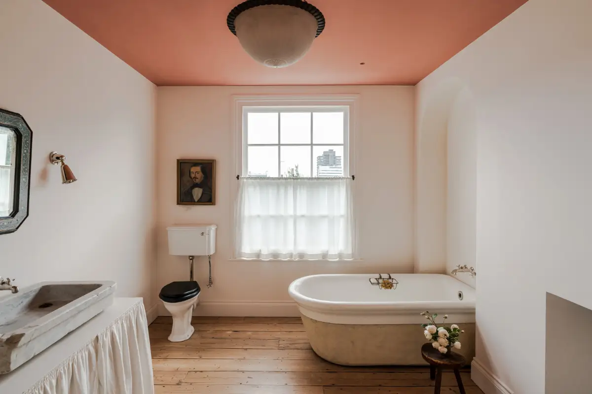 A Bright Late Victorian Townhouse in London 16 bathroom with freestanding bath terracotta colored ceiling nordroom