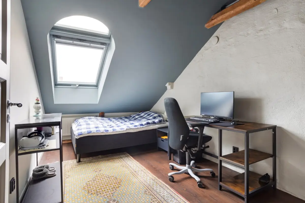 bedroom blue slanted ceiling wooden beams