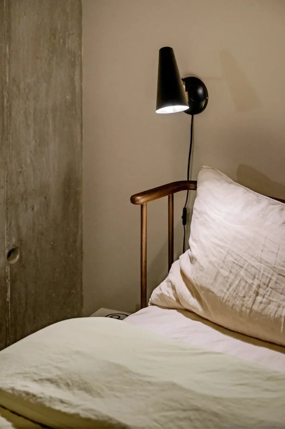 A Modern Swedish Apartment with Half-Painted Pink Walls 17 bedroom detail