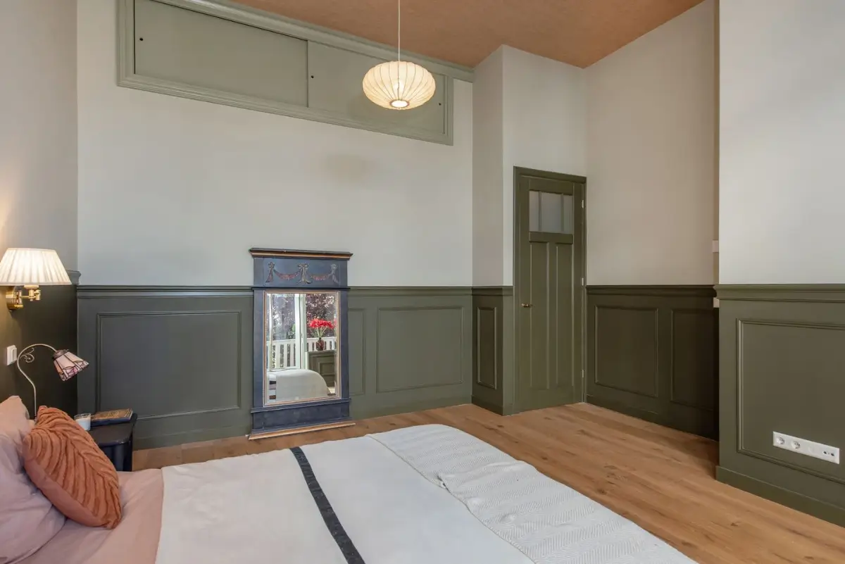 Art Nouveau Elegance Meets Modern Living in a Pink & Green Apartment 19 bedroom green paneling