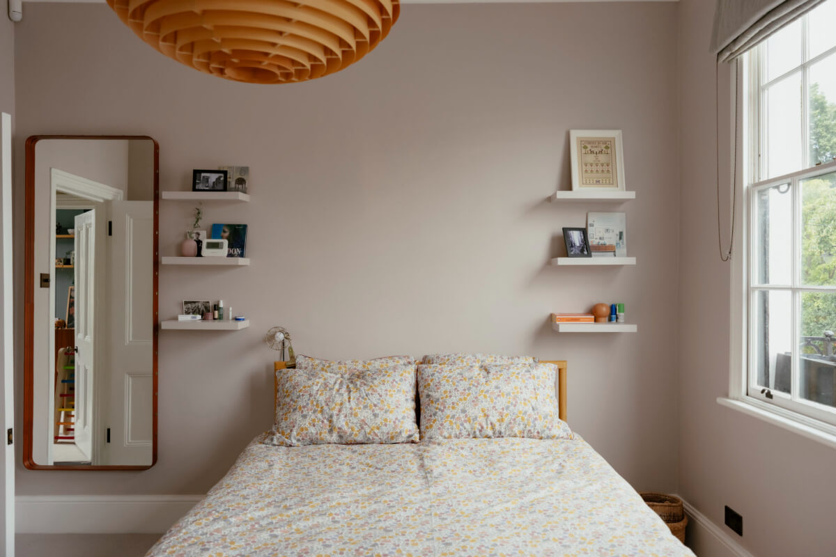 bedroom with shelves instead of bedside tables