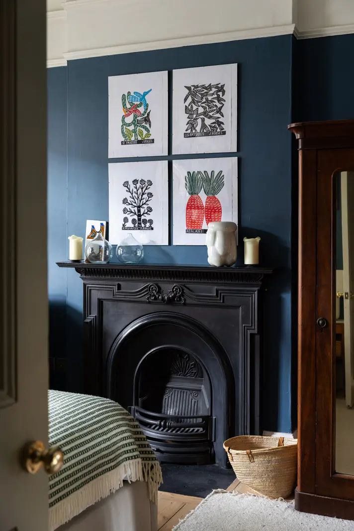 A Modern Extension and Period Details in a Ground Floor London Home 13 black fireplace in blue bedroom nordroom