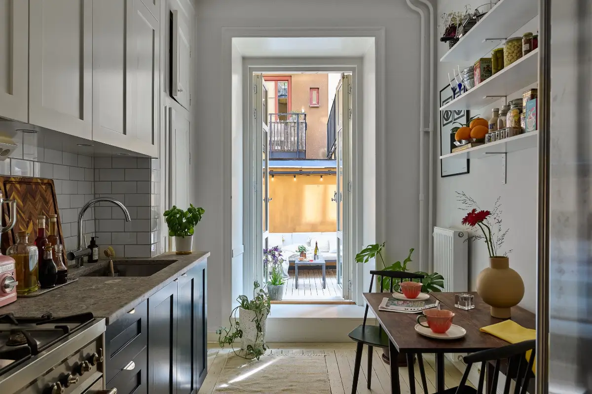 A Colorful Stockholm Apartment with a Large Terrace 8 blue and white kitchen