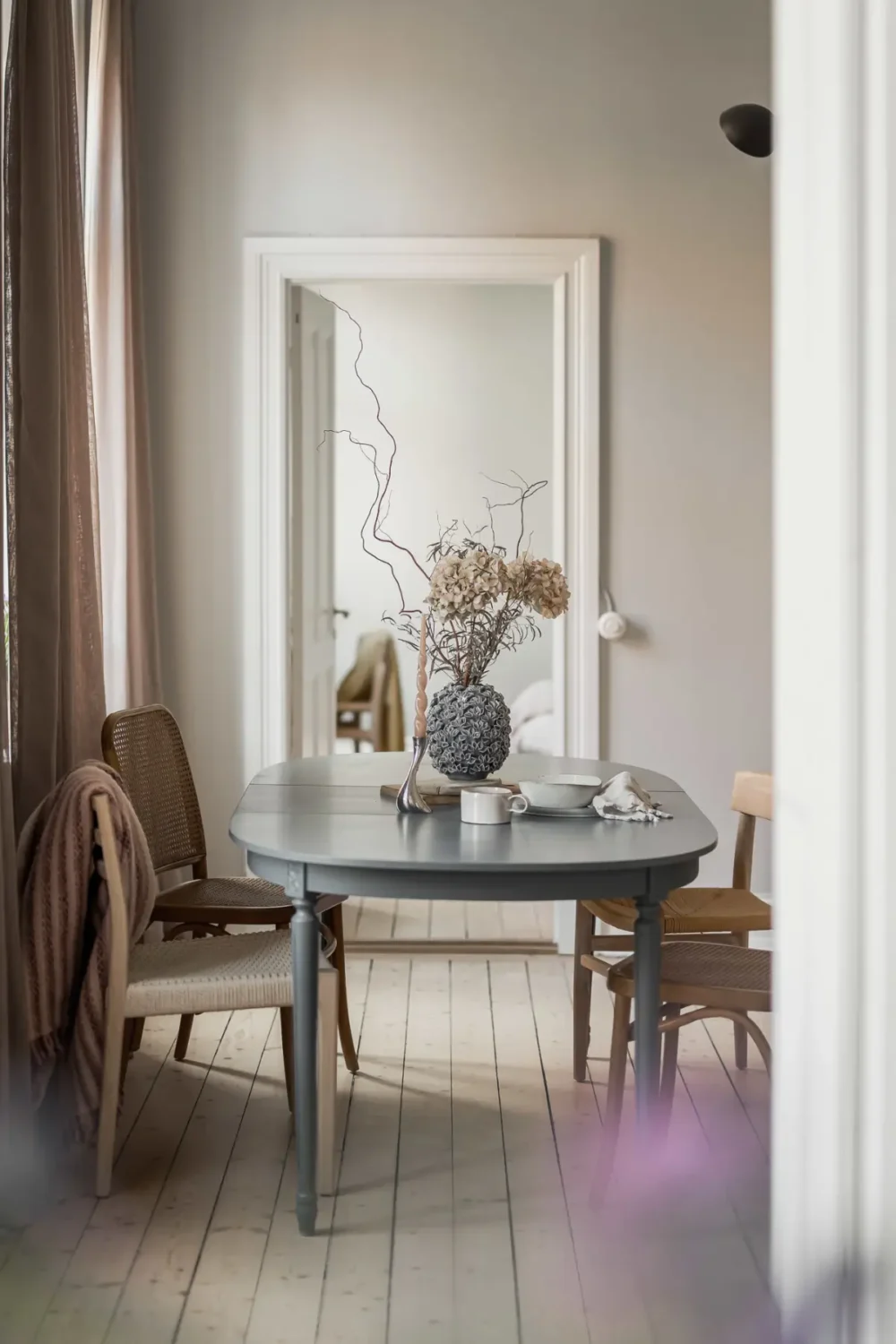 A Gray Scandinavian Apartment with a Royal History 8 blue dining table