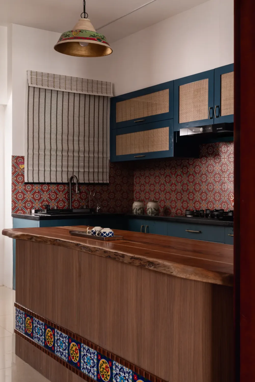 A South Indian Family Home Where Heritage Meets Bold Color Choices 8 blue kitchen cabinets with island