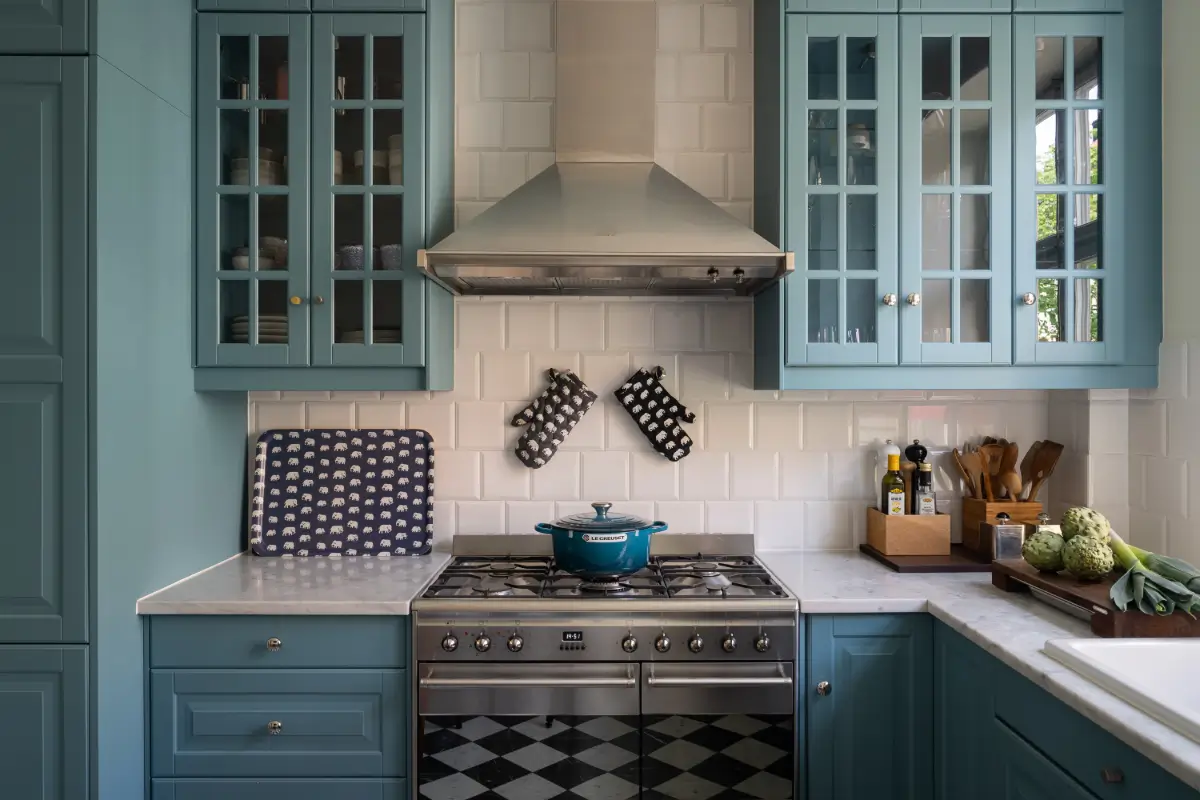 A Classic Stockholm Apartment with a Sky-Blue Kitchen 7 blue kitchen marble countertop