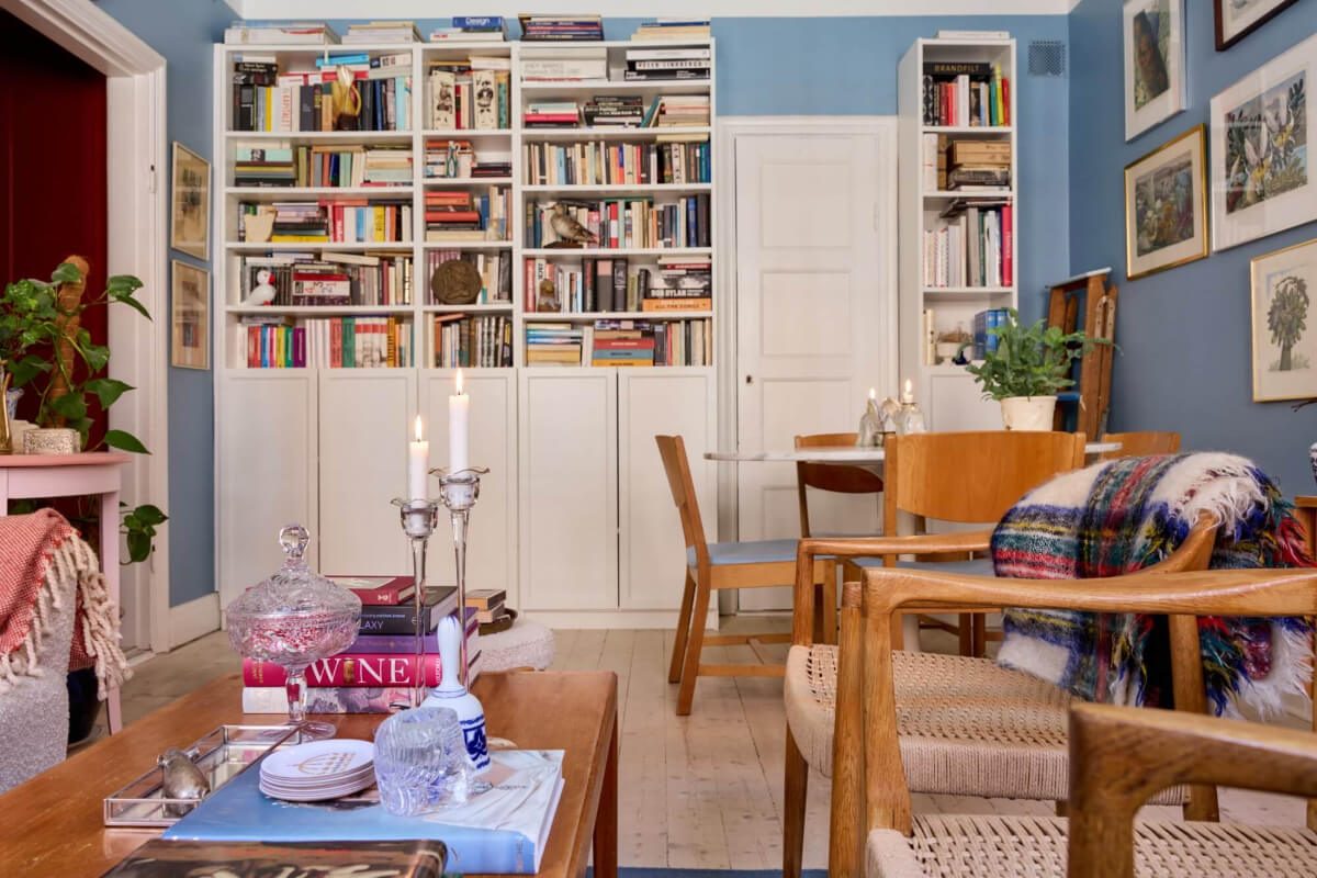 A Blue Living Room Filled with Art in a Swedish Apartment 7 blue living room with books and ar