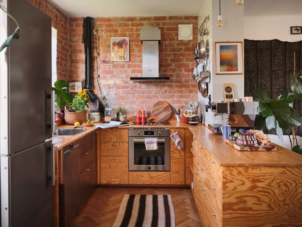 A Pink Bathroom and a Plywood Kitchen in a Stockholm Apartment 2 brick wall kitchen