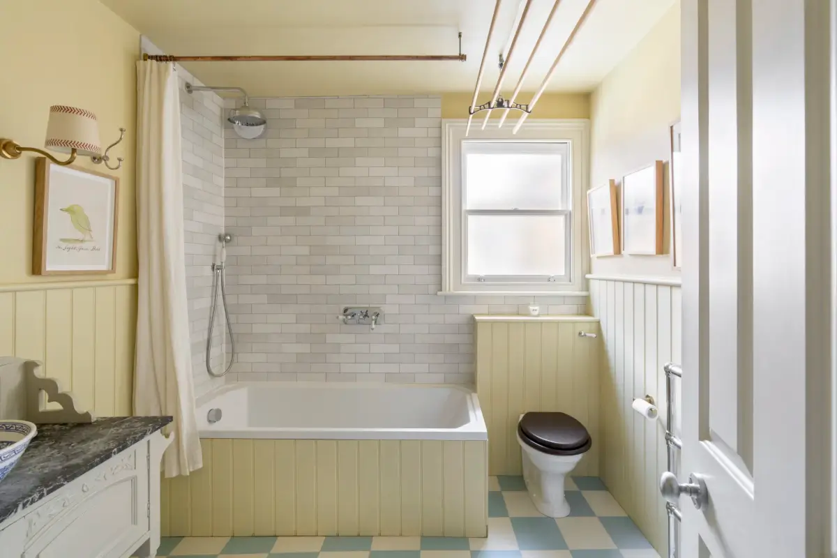 butter-yellow bathroom blue and white checkered floor