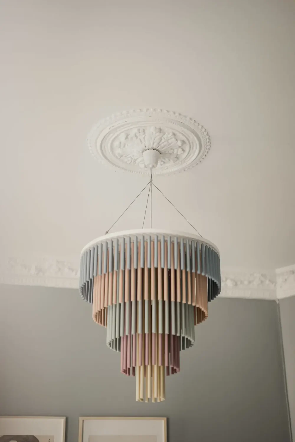 A Gray Scandinavian Apartment with a Royal History 21 ceiling rose and pastel colored pendant