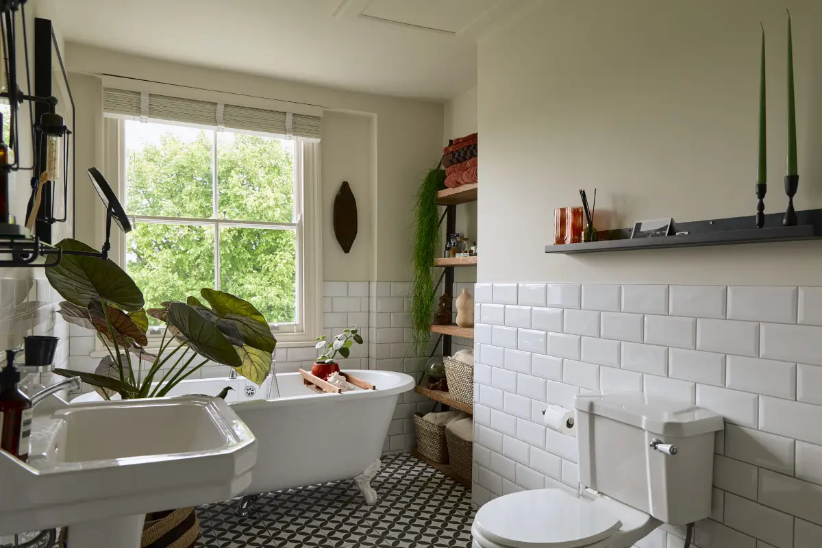 A Classic Victorian Duplex with a Lush, Private Garden in London 25 classic bathroom white tiles freestanding bath wooden shelves