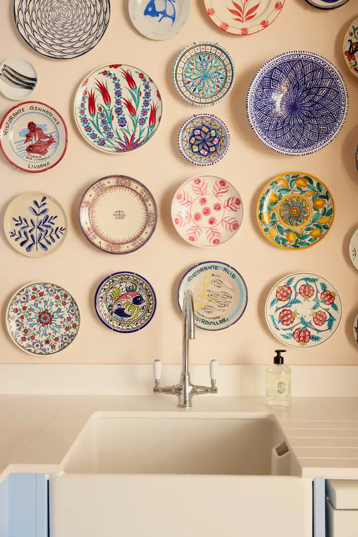 Pastel Hues in a Two-Bedroom Garden Apartment in West Kensington 5 colorful plates as wall decor