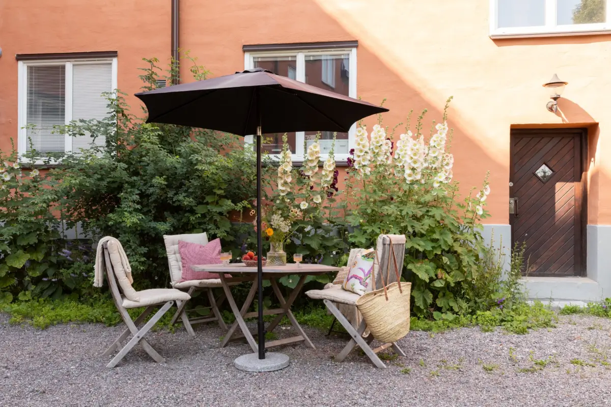 A Cozy Colorful Family Apartment with an Industrial Room Divider 23 communal garden seating A Cozy Colorful Family Apartment with an Industrial Room Divider