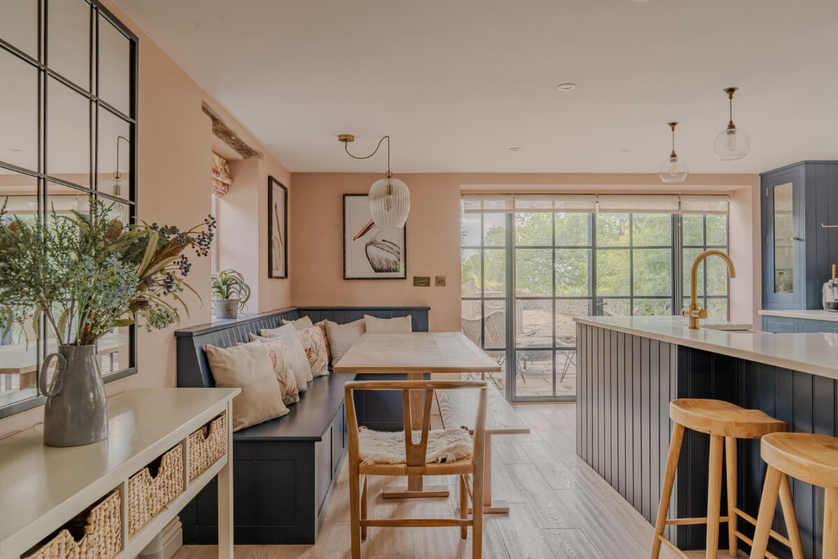 cottage kitchen pink walls blue cabinetry