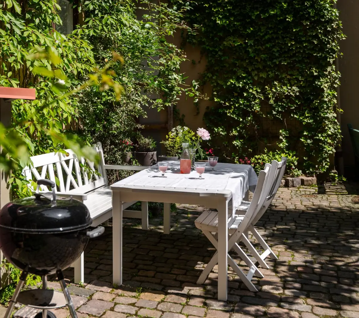 A Dark Gray Swedish Apartment with an Olive Green Kitchen 27 courtyard garden