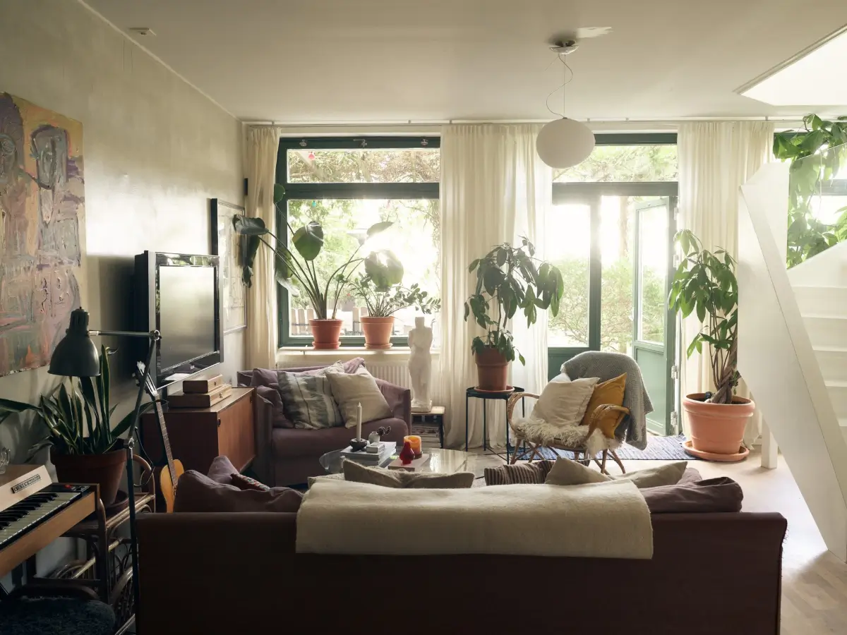 Industrial Elements in a 1960s Duplex Apartment in Stockholm 2 cozy living room garden doors