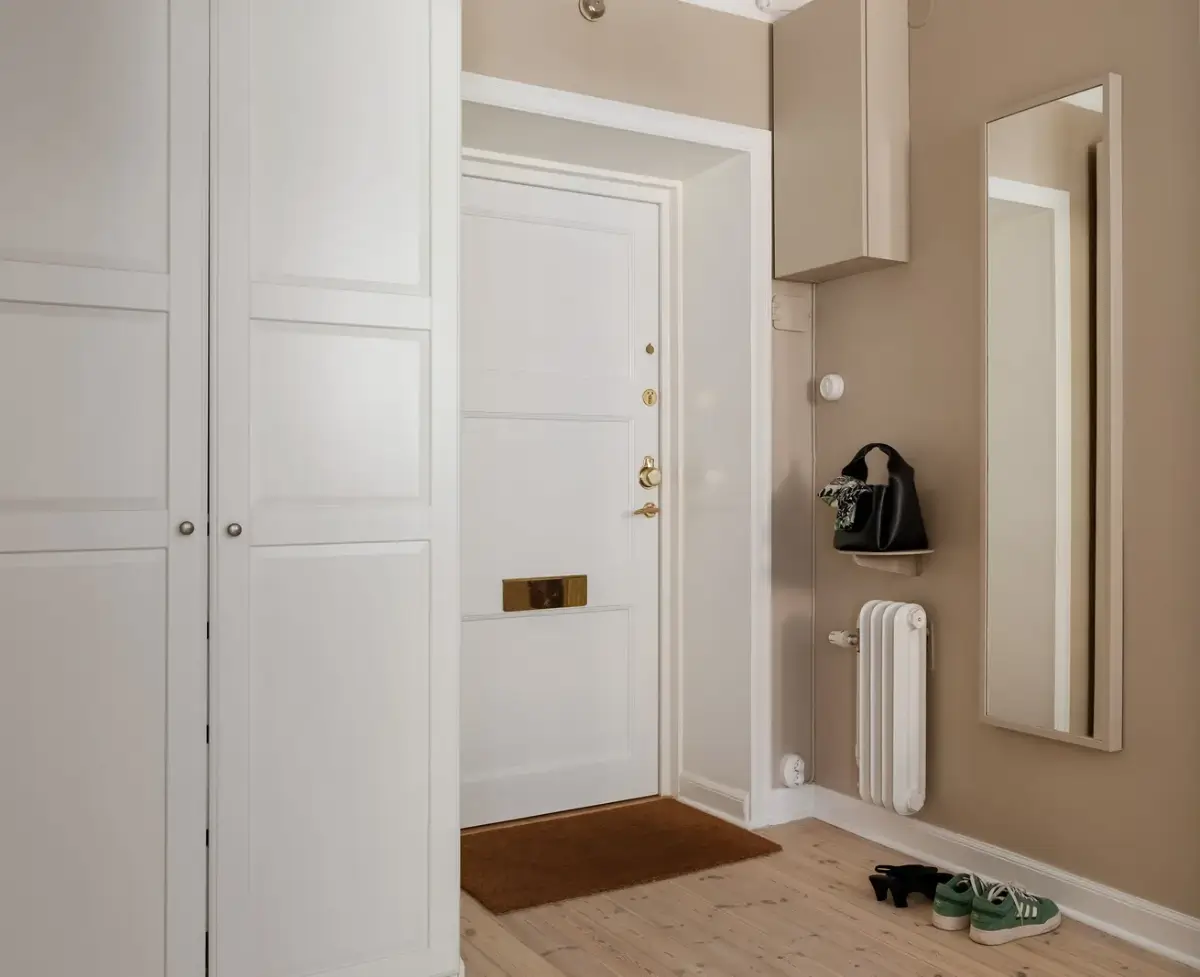 A Red Kitchen in a Small and Light Scandinavian Apartment 17 dark beige hall with wardrobes A Red Kitchen in a Small and Light Scandinavian Apartment