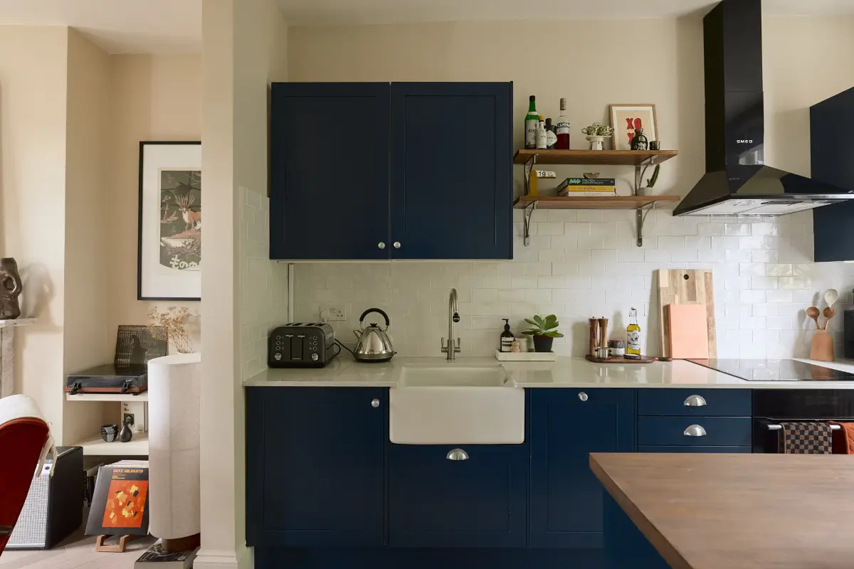 A Classic Victorian Duplex with a Lush, Private Garden in London 11 dark blue kitchen butler sink