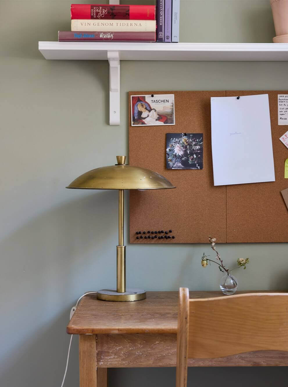A Blue Living Room Filled with Art in a Swedish Apartment 14 desk detail