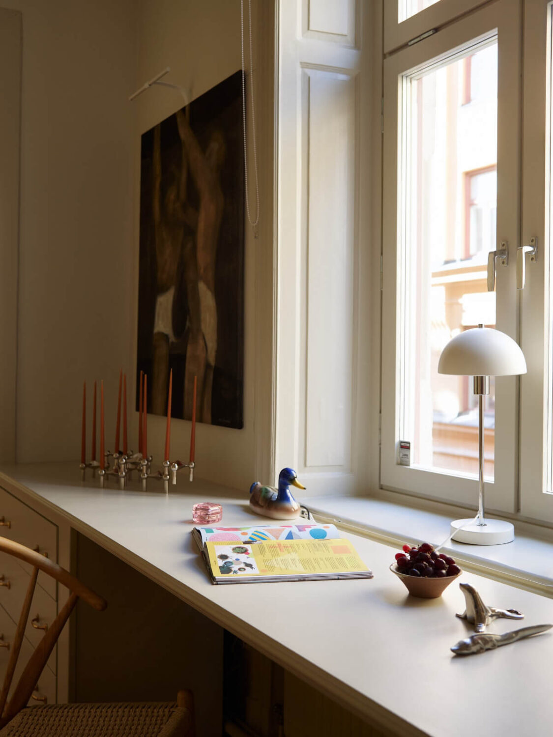 Blue and Red Color Accents in a Stylish Scandinavian Apartment 17 desk under window