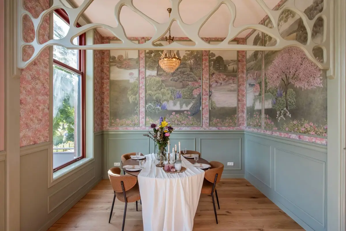 Art Nouveau Elegance Meets Modern Living in a Pink & Green Apartment 4 dining niche green paneling decorative murals