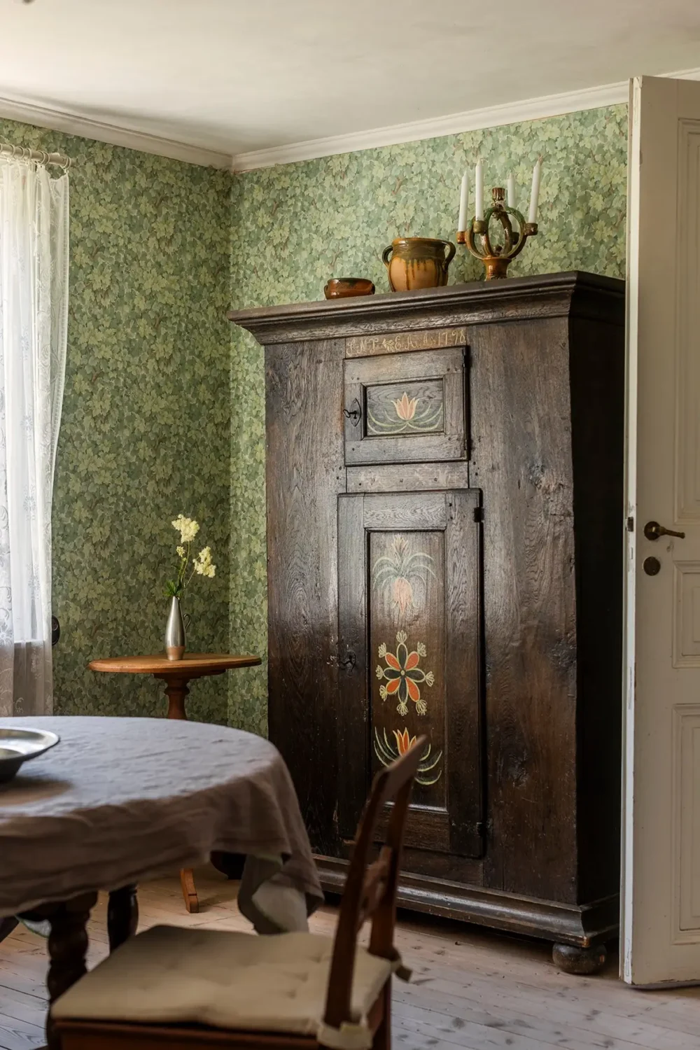 A Historic Lakeside Summer House in the Stockholm Archipelago 7 dining room antique cabinet