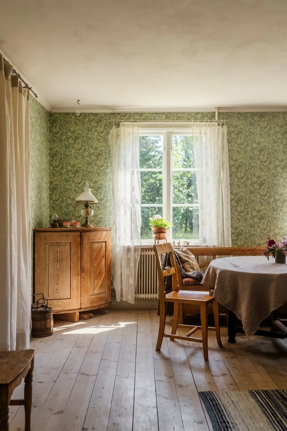 A Historic Lakeside Summer House in the Stockholm Archipelago 4 dining room green wallpaper