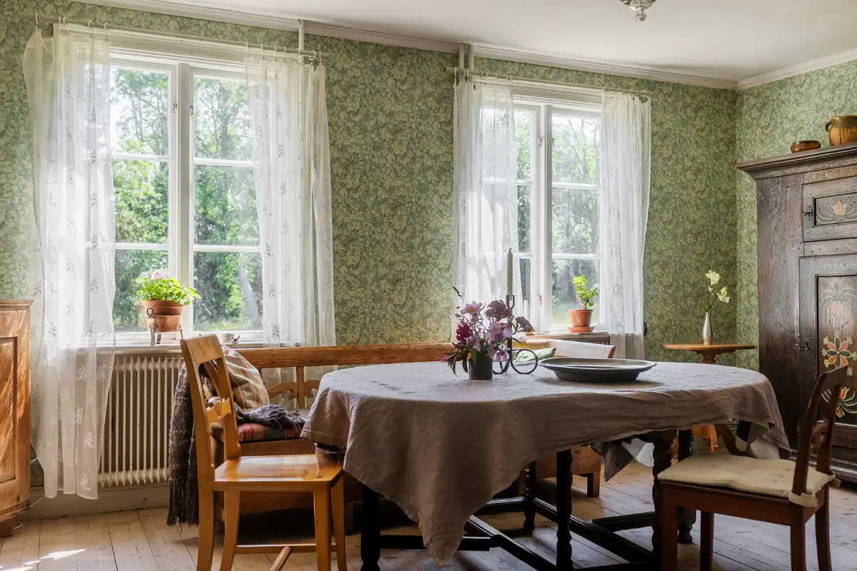 A Historic Lakeside Summer House in the Stockholm Archipelago 6 dining room green wallpaper country house