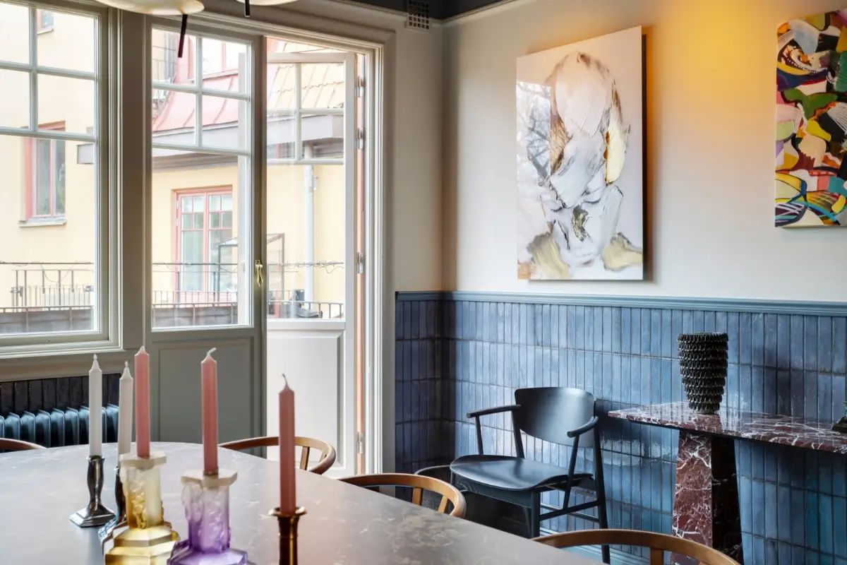dining room half blue-tiled walls