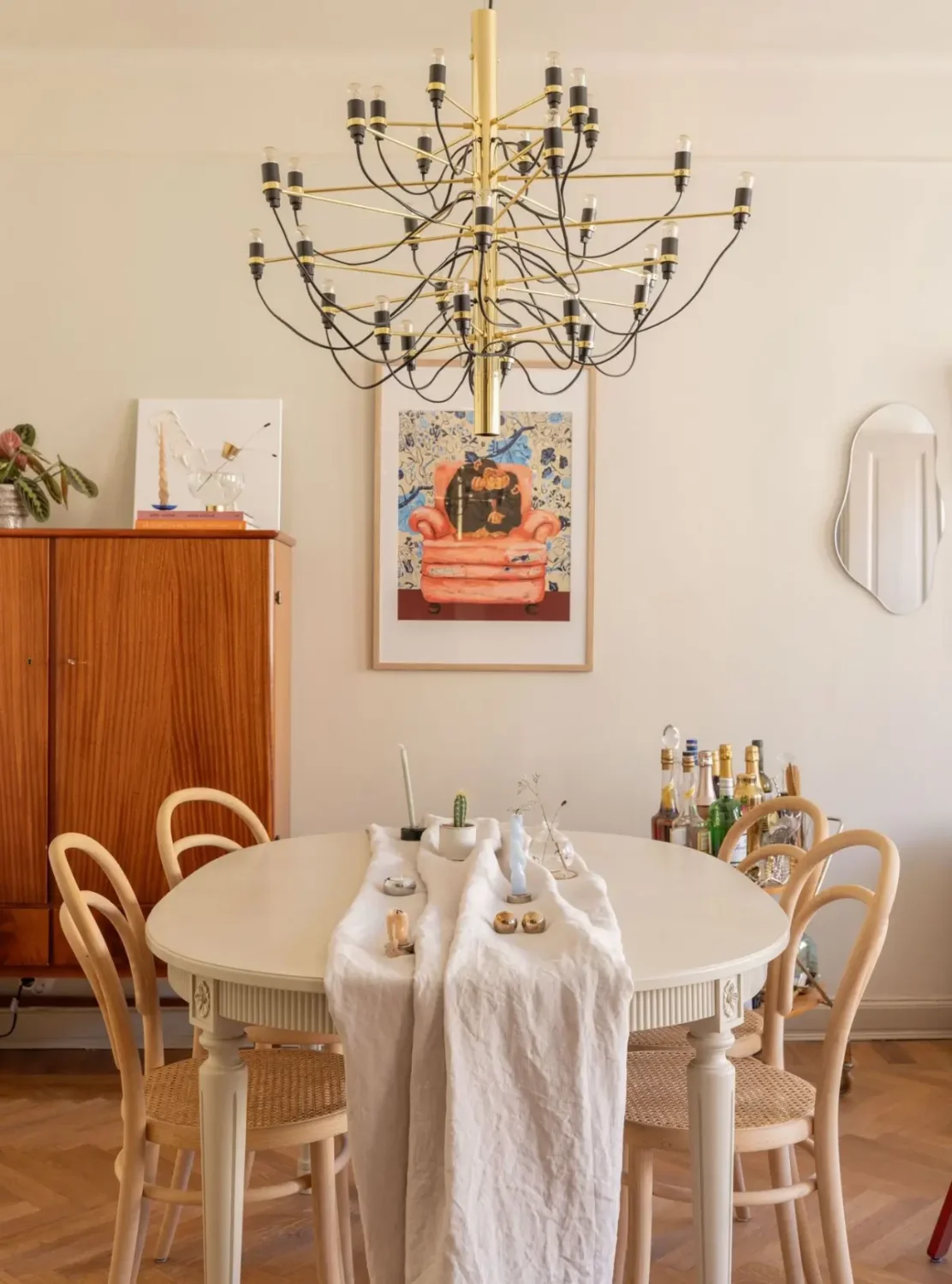 A Small Beige Stockholm Apartment with Plenty of Storage 9 dining table flos chanderlier nordroom